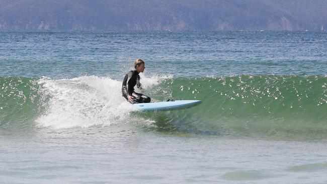 Tasmanian ironman Matt Bevilaqua visited the Clifton Beach Surf Life Saving Club to run a Christmas Eve training session with their nippers. Picture: MATHEW FARRELL