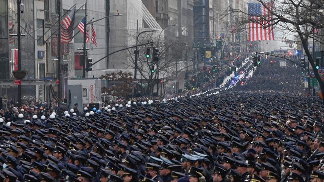 New York police officers gather for the funeral of NYPD officer Wilbert Mora on February 2 in New York. Mora, 27, along with partner Jason Rivera, were killed on January 21, as they responded to a domestic violence emergency. Picture: AFP