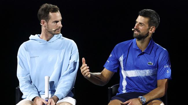 Britainâs Andy Murray (L) reacts with Serbiaâs Novak Djokovic during a charity event titled âNight with Novakâ on Rod Laver Arena in Melbourne on January 9, 2025 ahead of the Australian Open tennis championship starting on January 12. (Photo by DAVID GRAY / AFP) / -- IMAGE RESTRICTED TO EDITORIAL USE - STRICTLY NO COMMERCIAL USE --