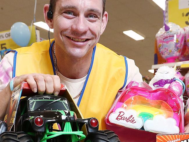 Big W Earlville is currently holding a toy mania sale, with 215 pallets of toys priced to sell fast. Big W Earlville hardgoods team leader Chris Higginson loads up on popular selling toys. Picture: Brendan Radke