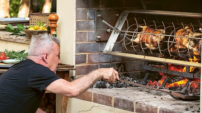 The Cooking Class Man hard at work in his favourite outdoor kitchen. Photo: Alan Benson.