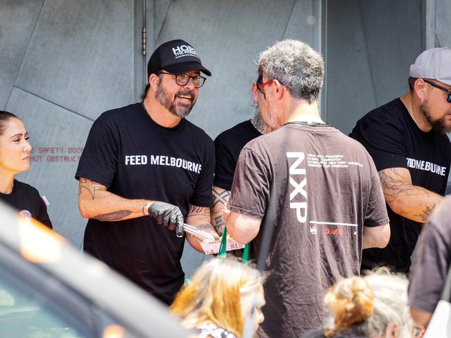 ‘Nicest guy in rock’ serving food to the needy in Melbourne last December. Picture: Mark Stewart