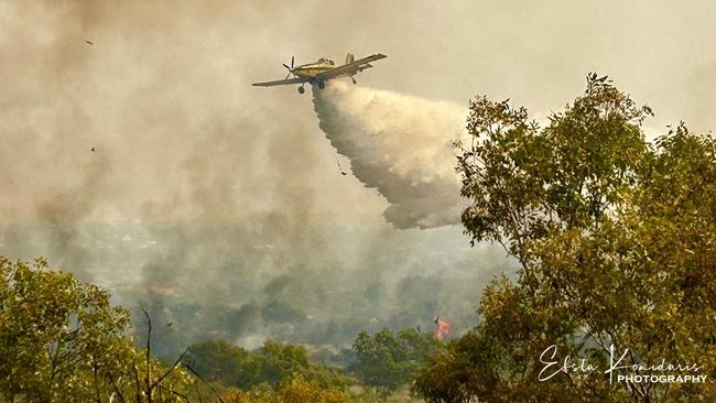 Efsta Konidaris captured images of water bombers helping to douse the Tennant Creek bushfires at Battery Hill. Picture: Efsta Konidaris Photography