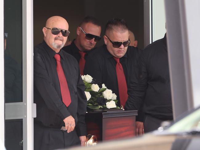 Shane Ross’s coffin leaves the church after his funeral service.