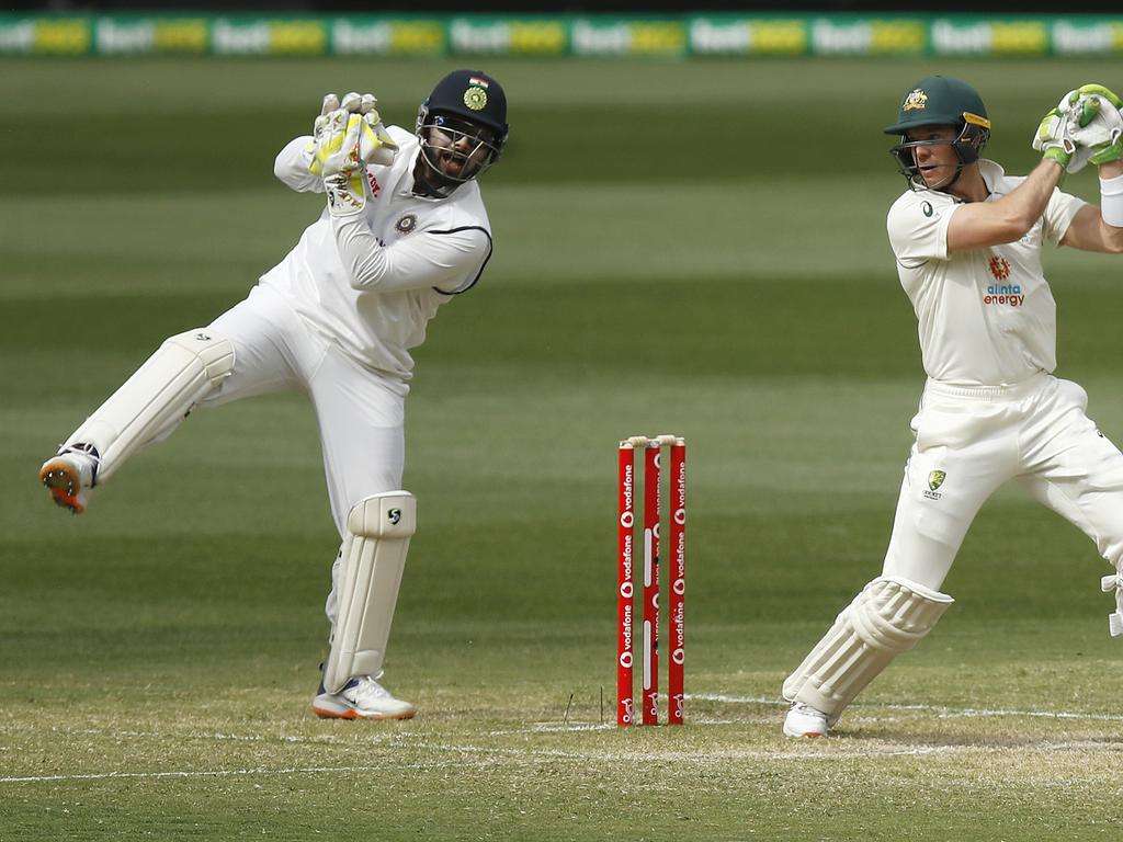 Rishabh Pant of India catches out Tim Paine of Australia.