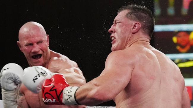 Barry Hall lands a shot on Paul Gallen. Picture: AAP