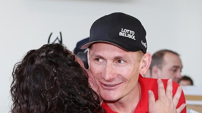 Andre Greipel is greeted at Adelaide Airport.