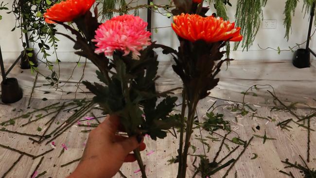 A mysterious curator has created a floral installation on Tedder Ave at Main Beach. Picture: Jason O'Brien