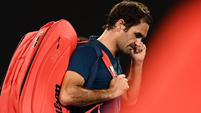 Roger Federer leaves Rod Laver Arena. Picture: AFP