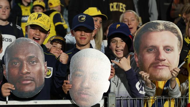SYDNEY, AUSTRALIA - MAY 20: Mariners fans with players heads cut outs during the second leg of the A-League Men's Semi Final between Central Coast Mariners and Adelaide United at Industree Group Stadium, on May 20, 2023, in Sydney, Australia. (Photo by Scott Gardiner/Getty Images)