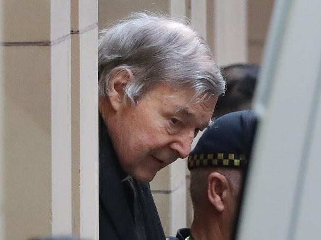 George Pell loses his appeal in the Supreme Court of Melbourne, and is led away in a prison van. Picture: Alex Coppel