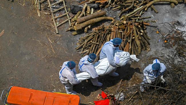 A victim is carried to the funeral pyre in New Delhi on Tuesday. Picture: AFP