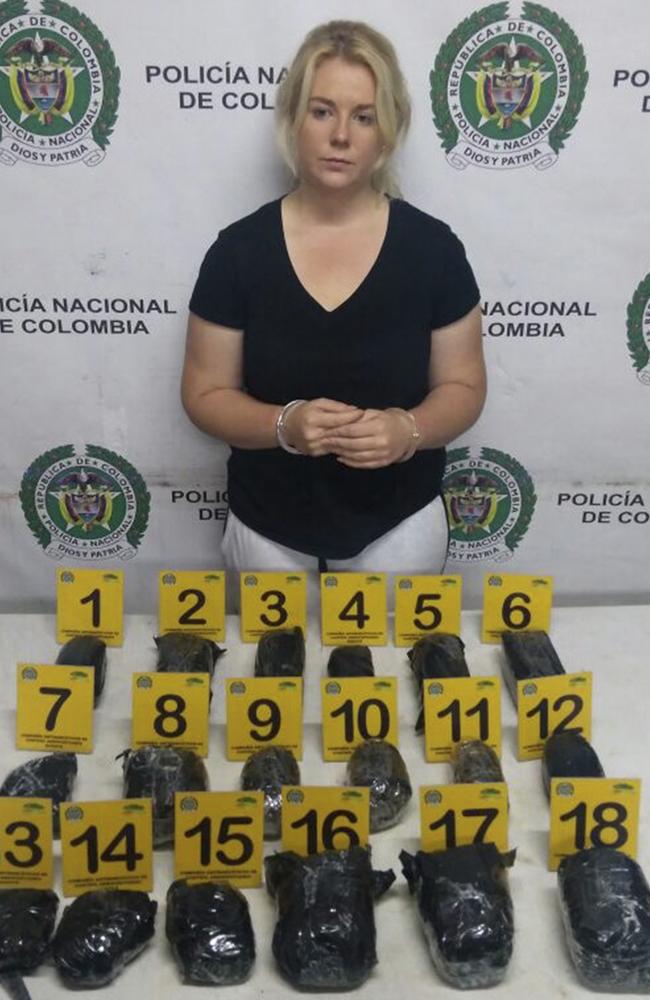 A photo released by Colombia's National Police press shows Australian Cassandra Sainsbury in handcuffs after she was arrested at the international airport in Bogota, Colombia. Picture: Colombia's National Police via AP