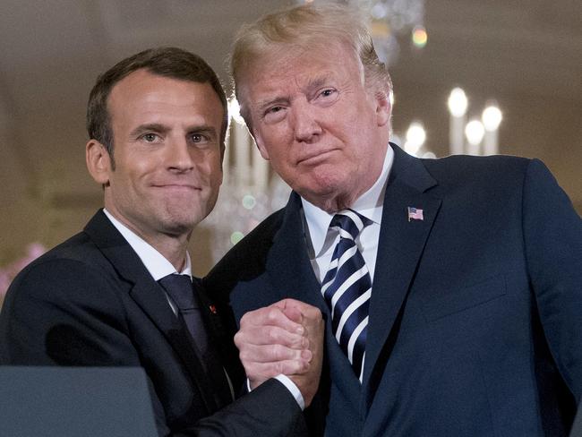 Donald Trump and Emmanuel Macron buddy up at the White House in April. Scott Morrison has been encouraged to take the French President’s lead. Picture: AP