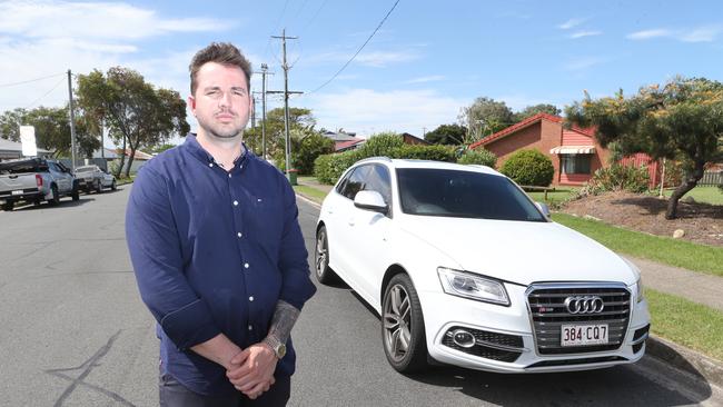 Photo of car theft victim Mitchell Booth with his stolen and since returned Audi. Picture: Richard Gosling