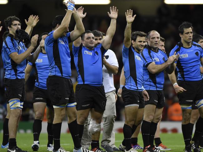 Uruguay players wave after losing their Pool A match with Wales. Picture: AFP