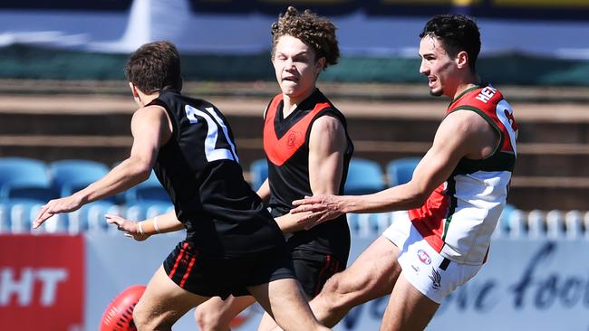 Izak Rankine gets his kick away for Henley during the SA school knockout competition’s preliminary final against Rostrevor at Woodville Oval last week. Picture: AAP/Mark Brake.