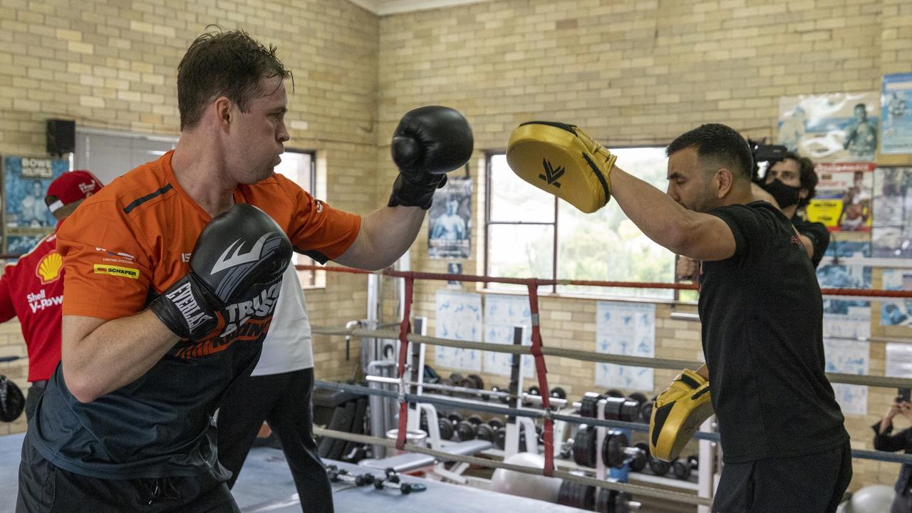 Jack Le Brocq punching pads with Tszyu’s trainer.