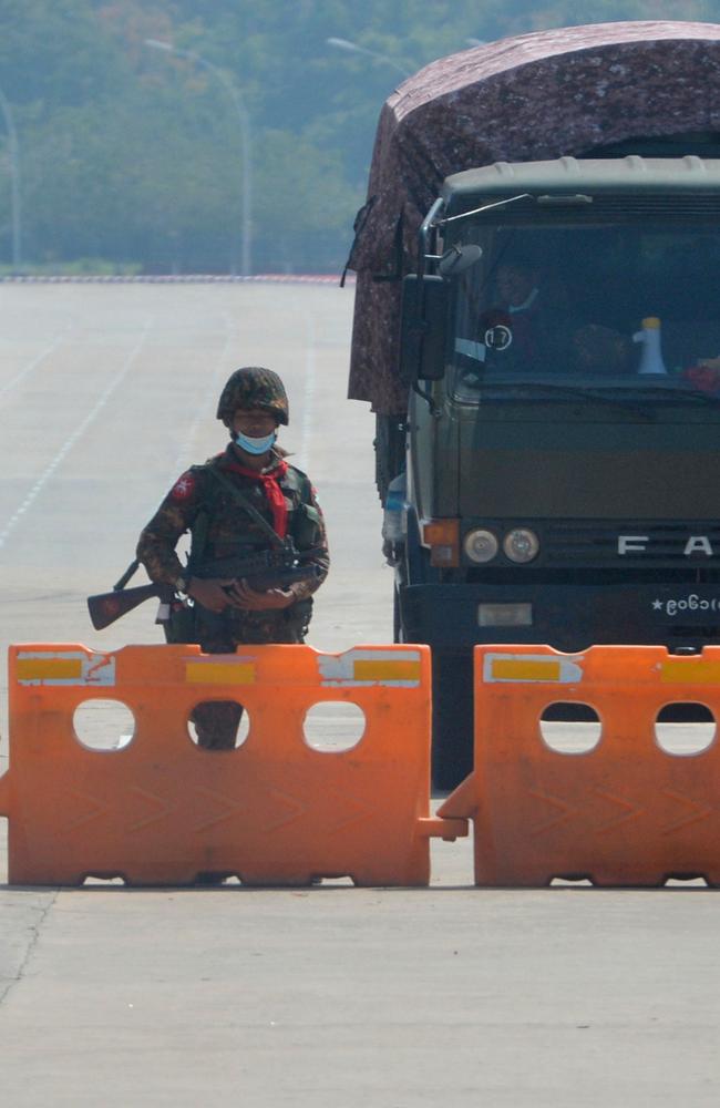 A soldier stands guard on a blockaded road to Myanmar's parliament in Naypyidaw after the military coup. Picture: Stringer