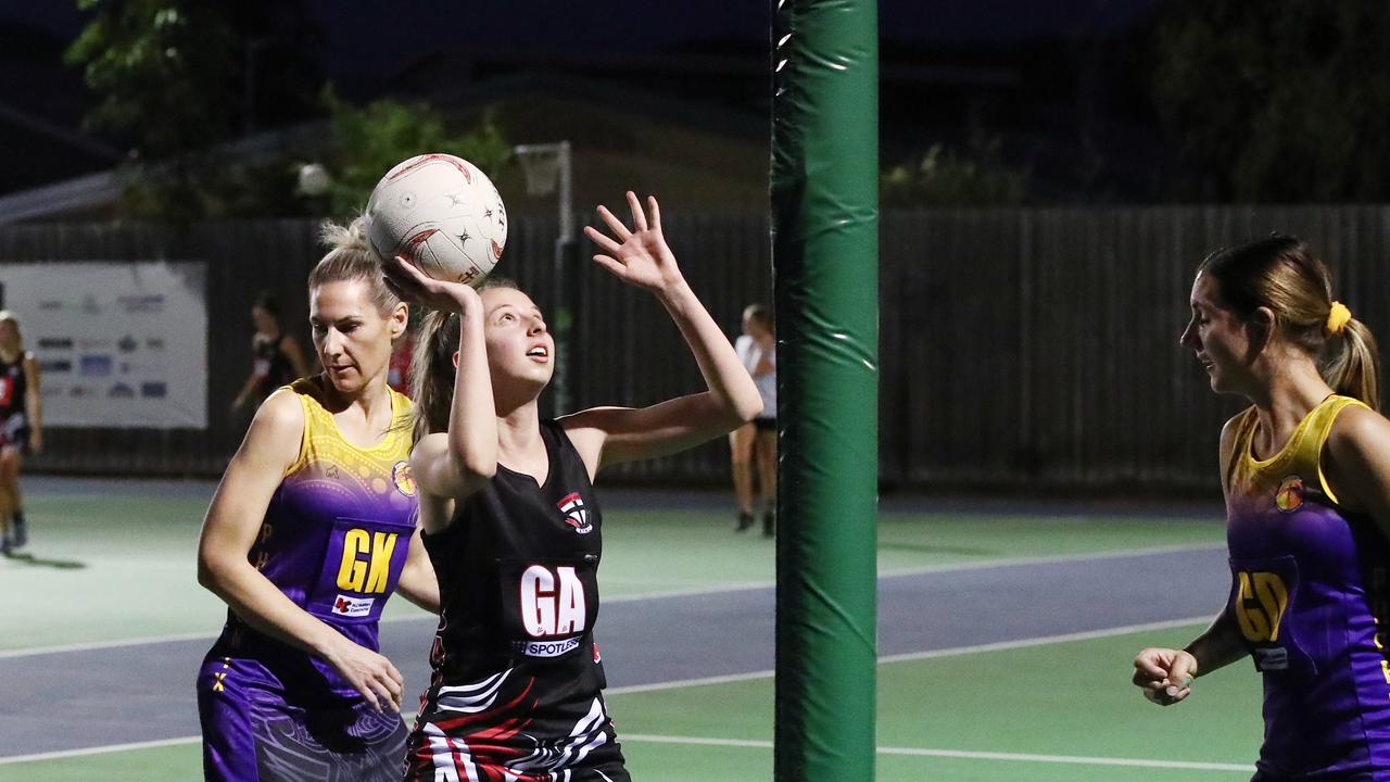 Saints' Kayla Bratberg gets a clear shot at goal in the Cairns Netball Association Senior Division 1 match between the Phoenix Fierce and the Cairns Saints. PICTURE: BRENDAN RADKE