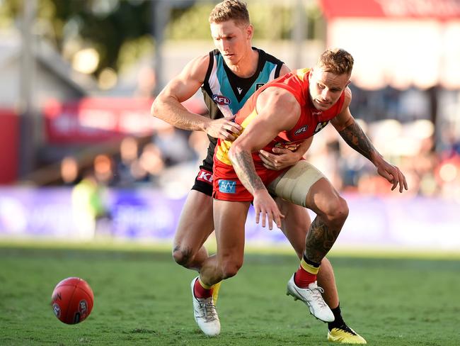 Kane Farrell (left) and Brandon Ellis go toe-to-toe. Picture: Matt Roberts/AFL Photos/via Getty Images