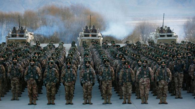 Chinese People's Liberation Army (PLA) soldiers assemble during military training at Pamir Mountains in Kashgar, northwestern China's Xinjiang region.