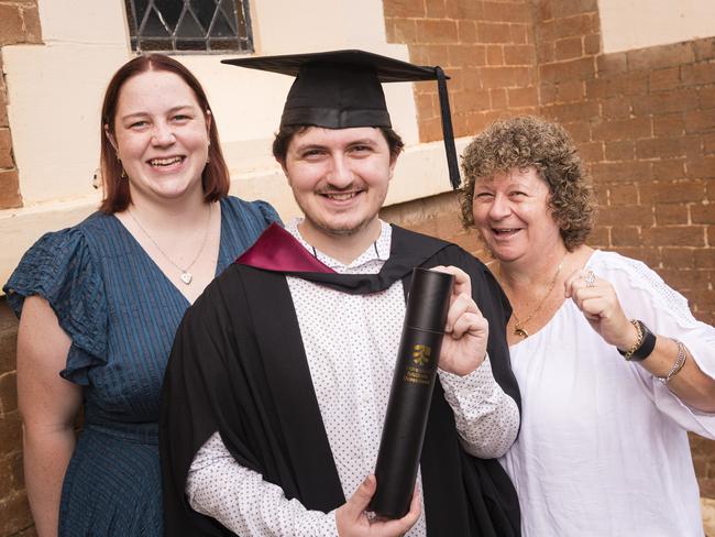 Bachelor of Engineering (Honours) graduate Joshua Carter with Taylor Hughes (left) and Michelle Carter at a UniSQ graduation ceremony at Empire Theatres, Wednesday, February 14, 2024. Picture: Kevin Farmer