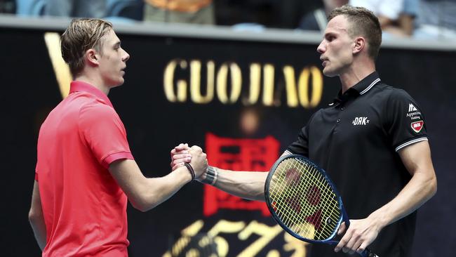 The pair shake hands after the match. Picture: AP/Dita Alangkara