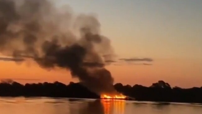 The houseboat burning yesterday afternoon. Picture: Nine Gold Coast News.