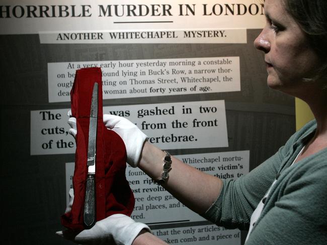 A member of staff holds the knife allegedly used by Jack the Ripper during a press preview for the exhibition, Jack the Ripper and the East End in London, 2008. Picture: Akira Suemori