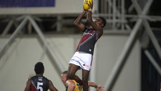 Anthony Munkara takes a brilliant mark for the Tiwi Bombers against PINT in Round 2 of the 2024-25 NTFL season. Picture: Pema Tamang Pakhrin