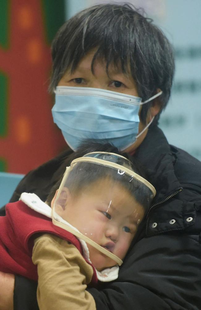 A child and an adult wait at a hospital in Hangzhou, eastern China's Zhejiang province, on January 6. Picture: AFP