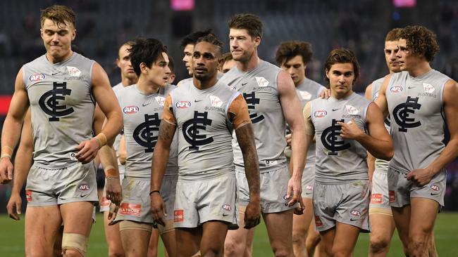 Patrick Cripps (left) leads the Blues from the field after Friday night’s big loss to St Kilda. Pic: AAP