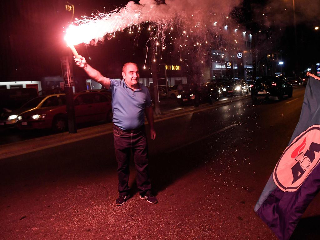 Supporters of the Greece's newly elected Prime Minister and leader of conservative New Democracy party Kyriakos Mitsotakis, celebrate outside the party's headquarters. Picture: AFP