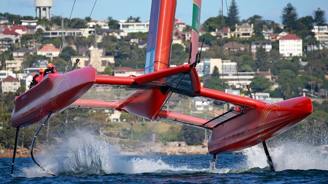 Team China get some air on Sydney Harbour. Picture: Toby Zerna