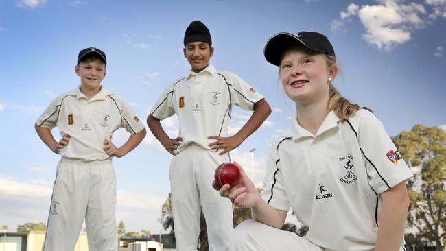 Port Adelaide under-14 white captain Abbi Manuel with teammates, Manmohan Singh, 13, and Xavier Southam, 11. Picture: Dean Martin