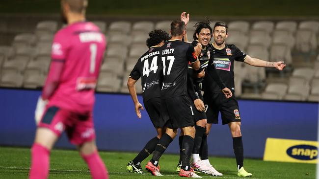 Kosta Petratos celebrates his first A-League goal with his Jets teammates Picture: Getty Images