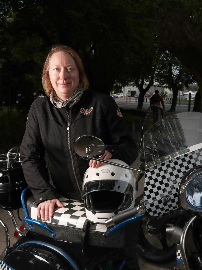 Sharon Heritage of Hobart with her Vespa that she is able to park for free around town compensating a little for the recent increase in fuel costs. Picture: Nikki Davis-Jones