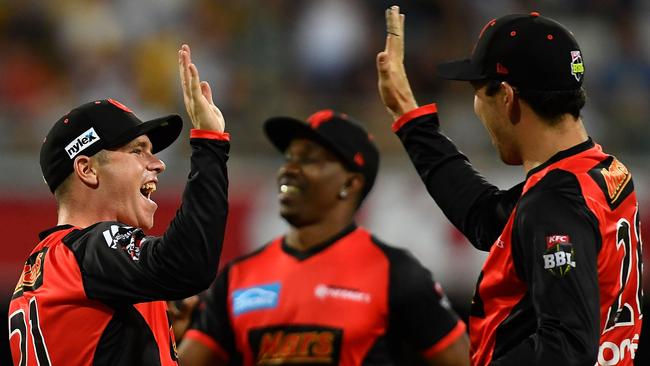 Marcus Harris (L) celebrates the key wicket of Chris Lynn, which helped the Renegades into the BBL finals.