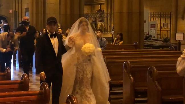 The boxer looked frail as he held his daughter’s hand down the aisle.