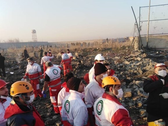 This picture, posted to Twitter but as yet unverified, is believed to show rescue teams on the scene after the Ukrainian International Airlines plane crash. Picture: Twitter