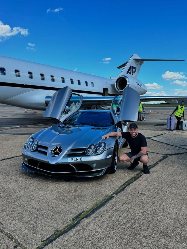 Posing with his AP-branded plane...