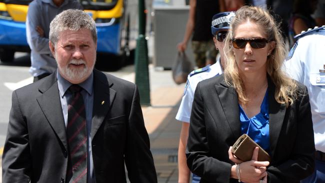 Police officers Donna MacGregor and Graeme Farlow outside the Supreme Court in Brisbane, in 2014 after giving evidence at the trial of Brett Peter Cowan. (AAP Image/Dan Peled)