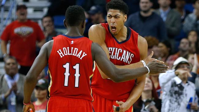 A pumped-up Anthony Davis celebrates with team mate Jrue Holiday.