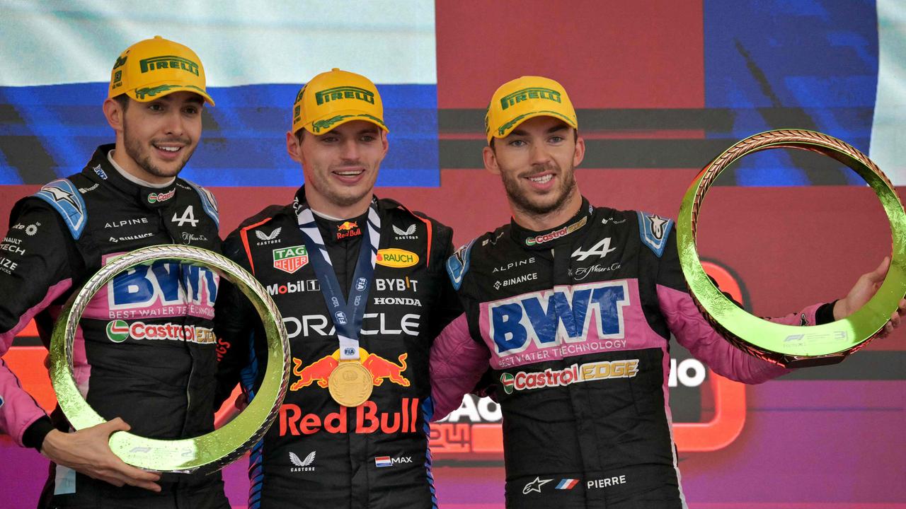 One of the more unlikely F1 podiums: Esteban Ocon, Max Verstappen and Pierre Gasly.(Photo by NELSON ALMEIDA / AFP)