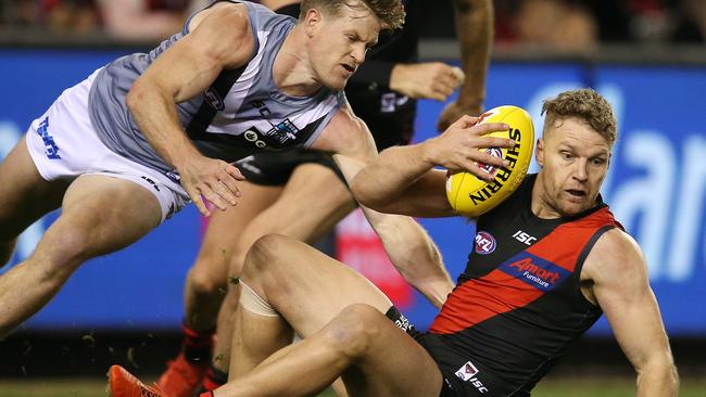 Essendon’s Jake Stringer has Tom Jonas breathing down his neck. Picture: Michael Klein