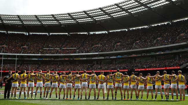 The Tigers during the national anthem. Picture: Getty