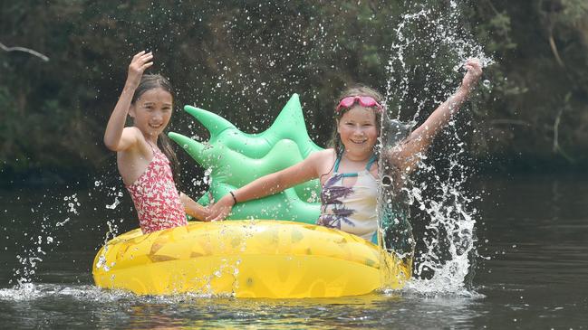 Holidaying friends Chloe and Tabea, both 10, enjoy a swim in Bright river. Picture: Tony Gough