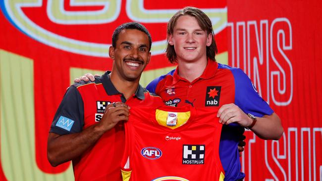 Moe’s Bailey Humphrey with Gold Coast star Touk Miller. Picture: Dylan Burns/AFL Photos via Getty Images