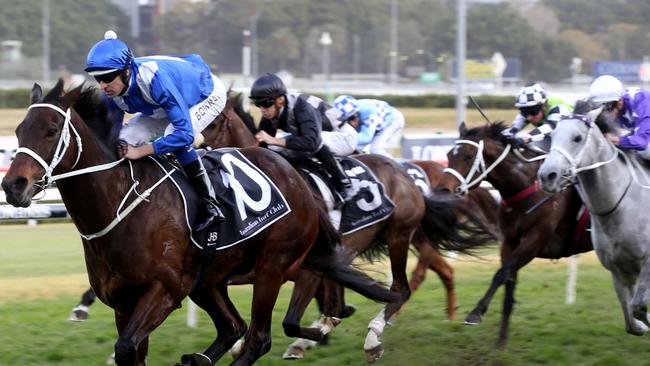 Jockey Hugh Bowman rides Winx (L) during the Winx Stakes horse race at the Royal Randwick race course in Sydney. Picture: AFP